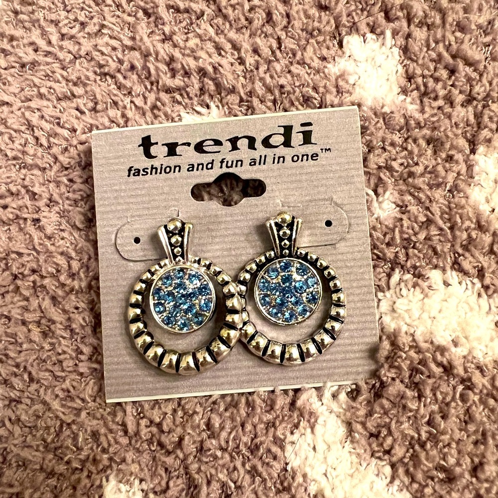 Trendi costume jewelry earrings. Silver color with blue stones. NWT. ~1” long.